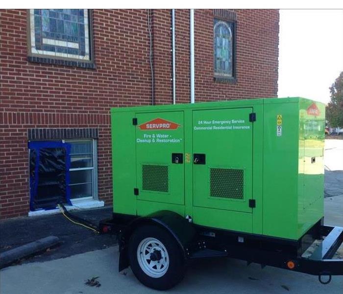 generator powering commercial building from outdoors