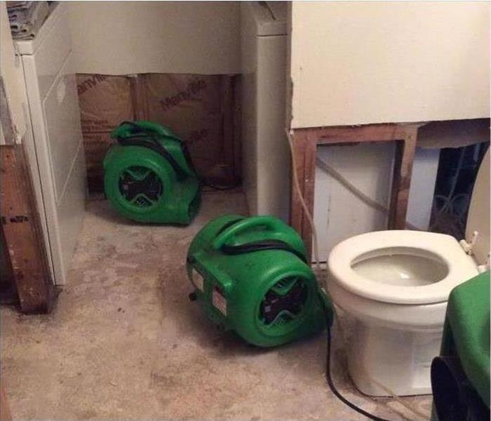 water damaged bathroom with air movers